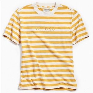 gold and white guess shirt